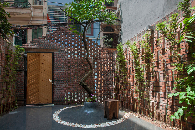 nghia-architect encloses maison T in hanoi behind a perforated brick façade