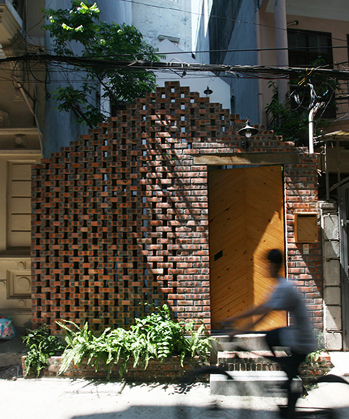 nghia-architect encloses maison T in hanoi behind a perforated brick façade