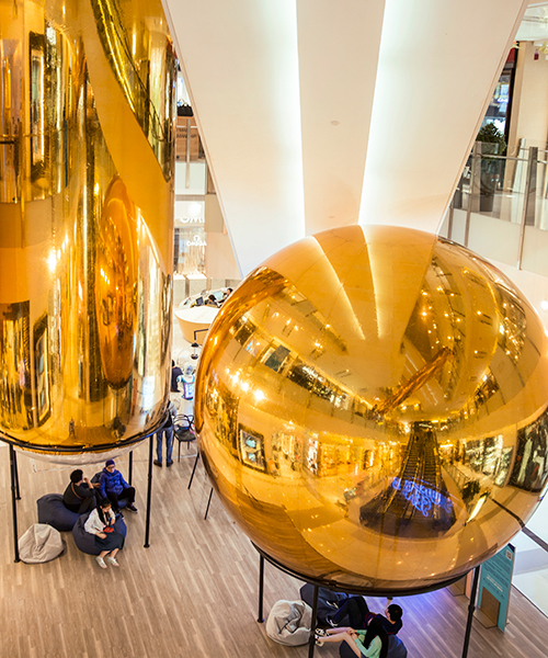 people's architecture office stretches golden bubbles through hong kong's K11 art mall