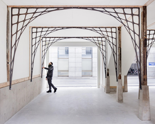 rei mitsui architects adds arched-frame structure to building renovation in tokyo