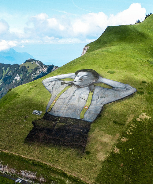 saype draws 10,000 square meter man in the mountains of leysin, switzerland