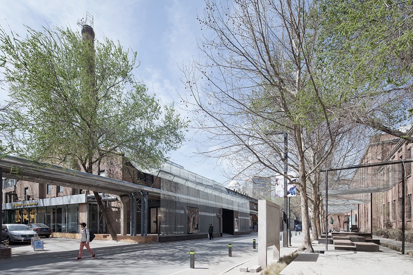 vector architects add iron mesh curtain to façade of M woods museum in beijing art district