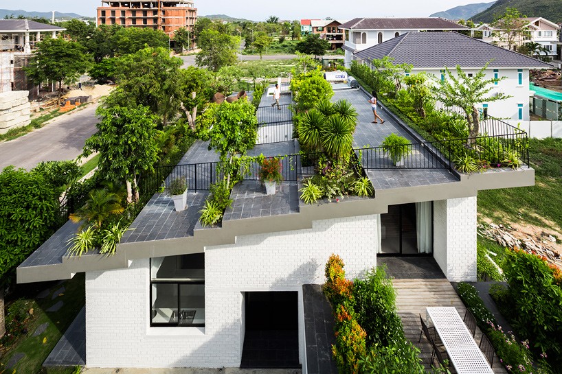 vo trong nghia covers residence with a flourishing stepped rooftop