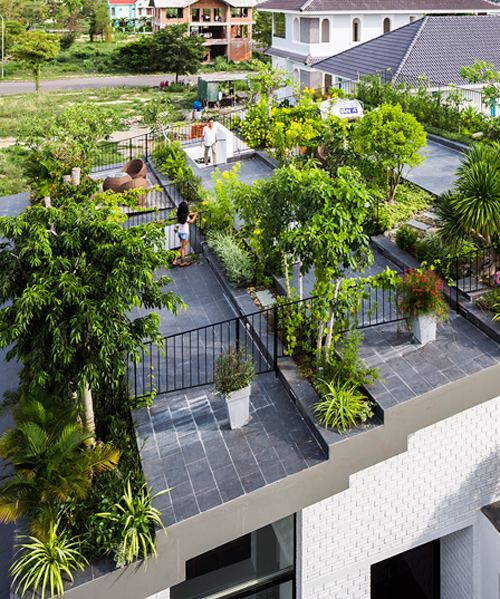 vo trong nghia covers residence with a flourishing stepped rooftop