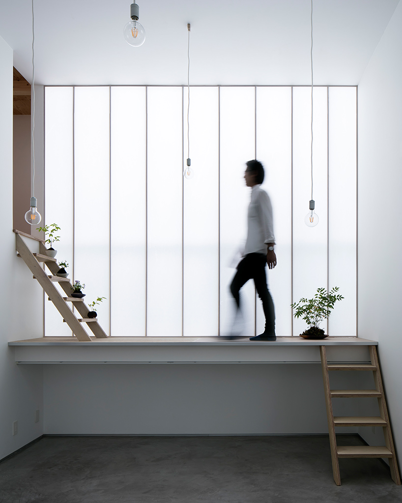 yoshiaki yamashita uses a giant shoji screen to illuminate osaka house