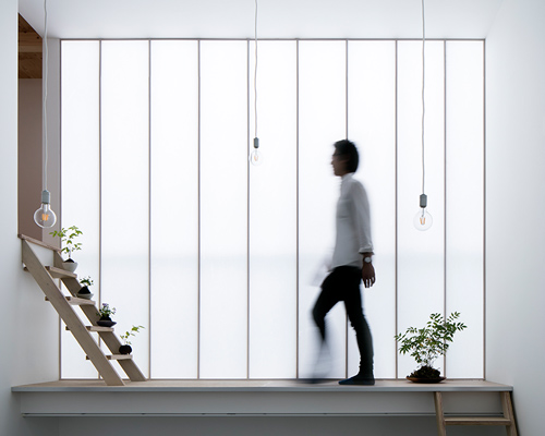 yoshiaki yamashita uses a giant shoji screen to illuminate osaka house