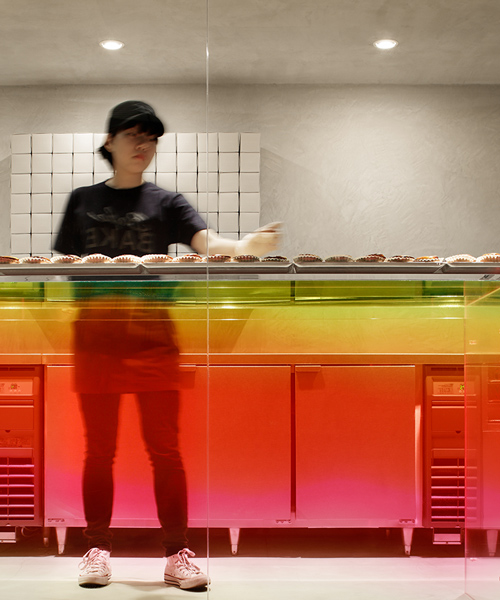 yota kakuda uses graduated colored acrylic surfaces in tokyo cheese tart store