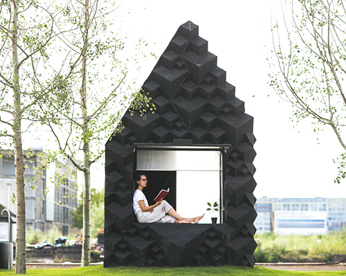 3D printed urban cabin by DUS architects sits along amsterdam's canalside