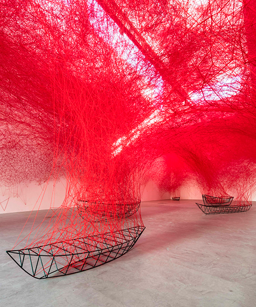 chiharu shiota tethers a labyrinth of red yarn to boat carcasses at blain|southern