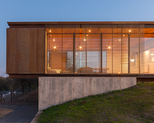 gaston sironi elevates LS house, a corten-clad dwelling in argentina