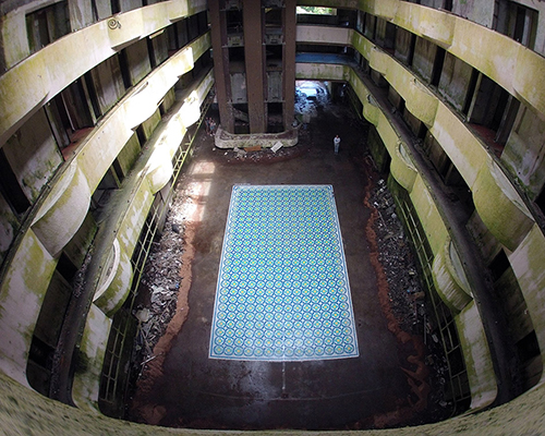 javier de riba spray paints patterned tile floor in an abandoned 5-star hotel in portugal