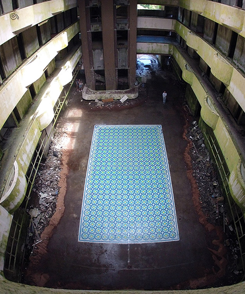 javier de riba spray paints patterned tile floor in an abandoned 5-star hotel in portugal
