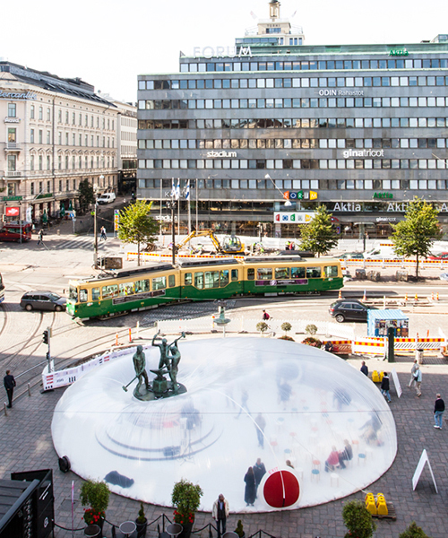 plastique fantastique inflates bubble around landmark in helsinki