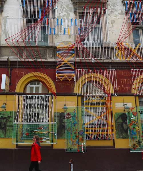 entropika intertwines past and present with woven façade in łódź, poland