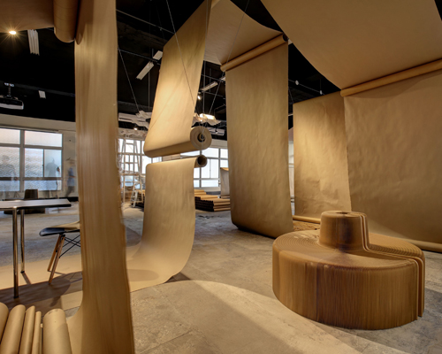 JC architecture drapes café in taipei with rolls of brown paper