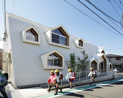 TSC architects punctuate japanese health clinic with house-shaped windows