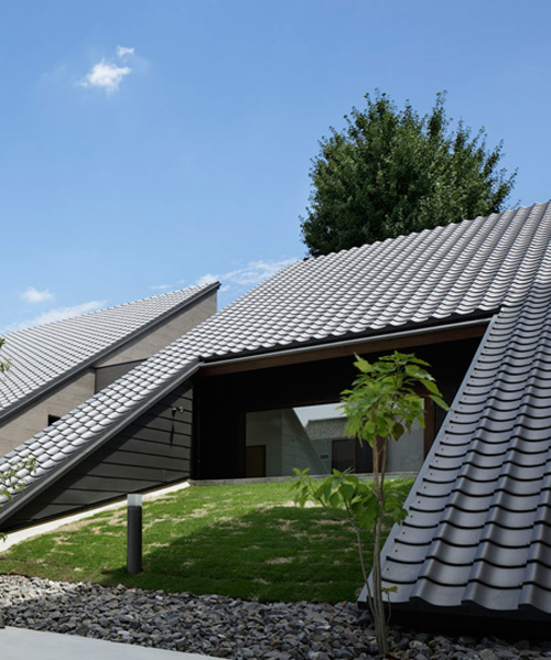 TSC architects clads wedge-shaped dental clinic in japan in tiles