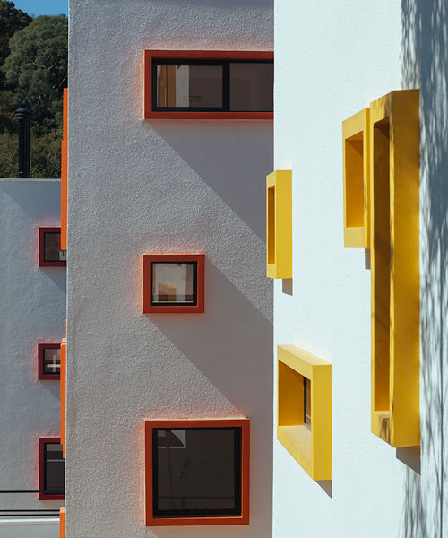 aleph zero's white cubic houses in brazil include colorful window frames