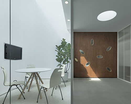 C+ architects illuminates a beijing office with strategic sun-drenched courtyards