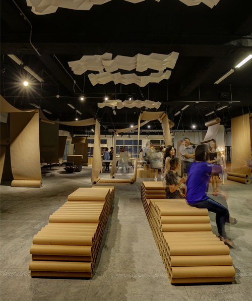 JC architecture drapes café in taipei with rolls of brown paper