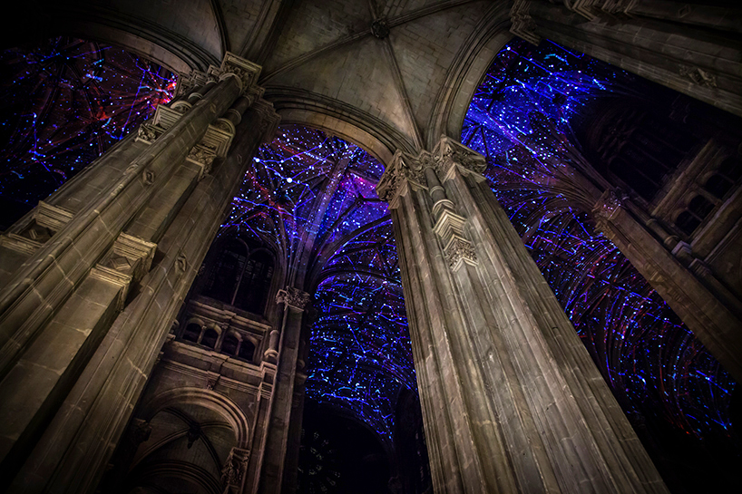 miguel chevalier projects a universe of digital constellations onto paris' saint-eustache church