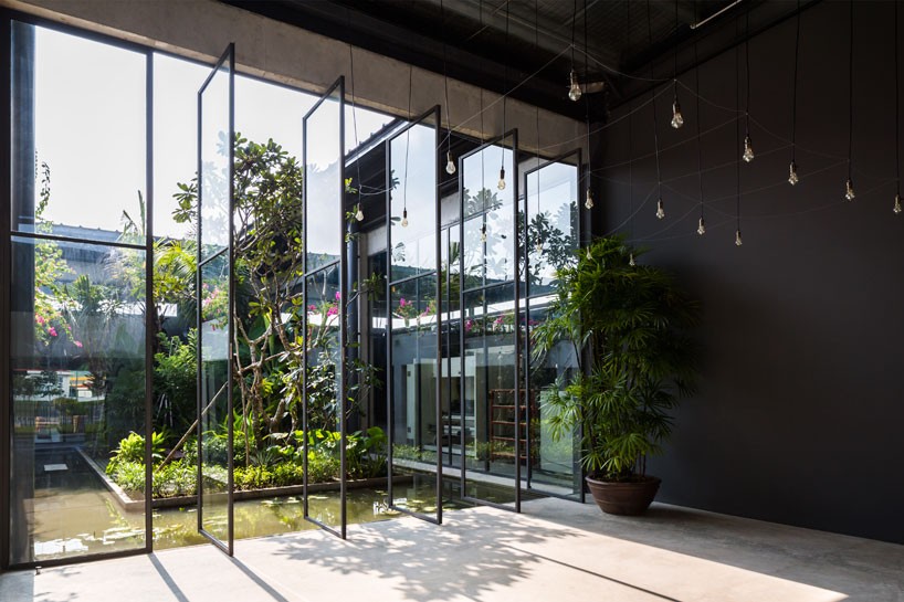NISHIZAWAARCHITECTS wraps steel factory space around an open-air tropical garden