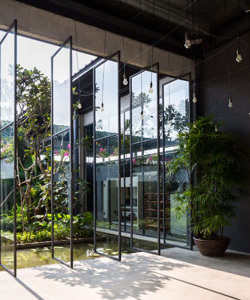 NISHIZAWAARCHITECTS wraps steel factory space around an open-air tropical garden