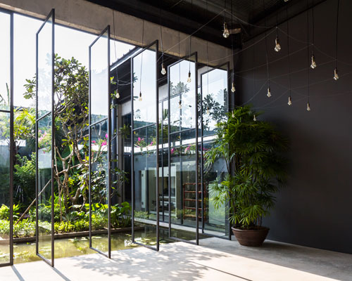 NISHIZAWAARCHITECTS wraps steel factory space around an open-air tropical garden