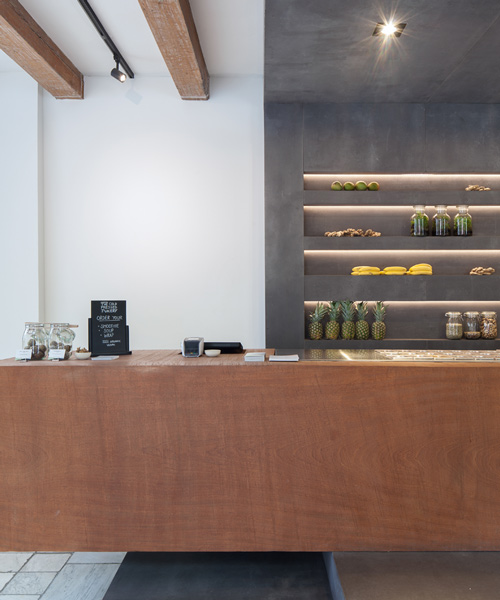 standard studio plays with contrasts inside cold pressed juicery in amsterdam