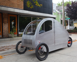 the future people introduce a fully enclosed electric moped at the cooper hewitt
