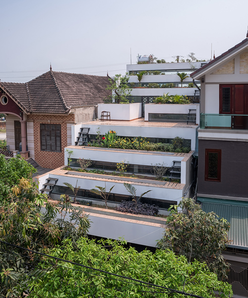 H&P architects creates tiered home in vietnam with stepped back terraces