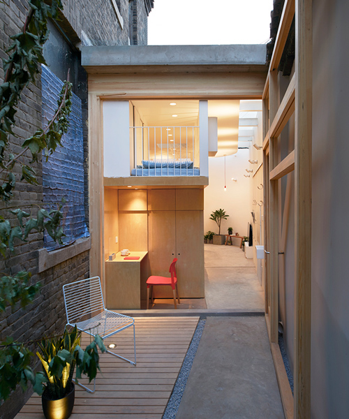 B.L.U.E architecture studio inserts home for six within beijing hutong
