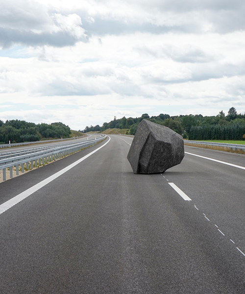 BORGMAN|LENK balance a papier-mâché boulder on a danish motorway