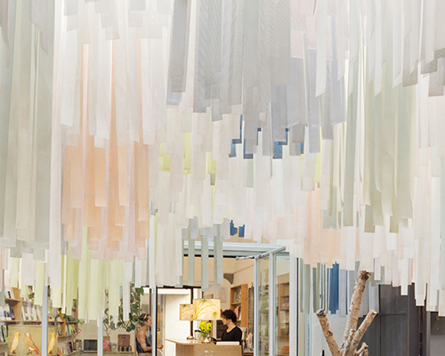 brac bookstore + café in florence features an undulating canopy of 5,000 fabric strips