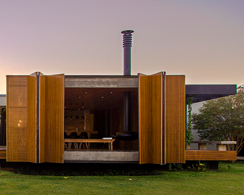 casa MCNY in brazil by mf+arquitetos has retractable floor-to-ceiling shutters