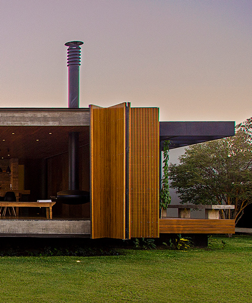 casa MCNY in brazil by mf+arquitetos has retractable floor-to-ceiling shutters
