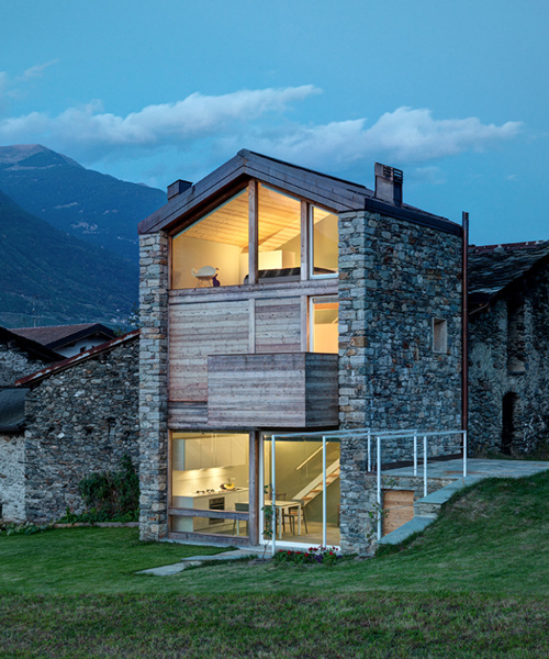rocco borromini adds timber façade to stone ruins to create SV house in northern italy