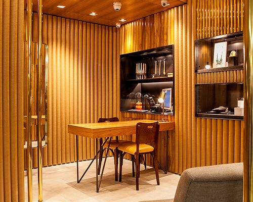 estúdio chão wraps são paulo jewelry store in wood, brass + cardboard