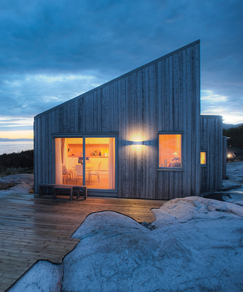 TYIN tegnestue architects embeds timber cottage into the rugged terrain in norway