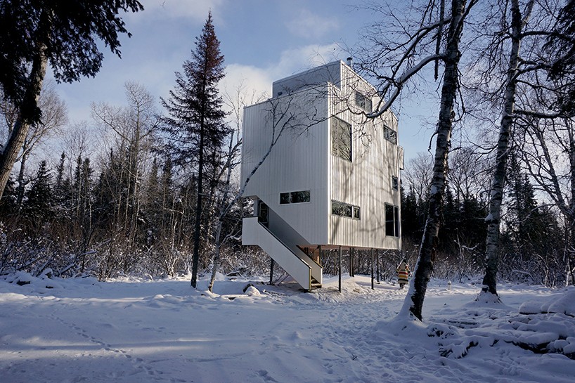 DIN projects elevate pole house overlooking lake winnipeg