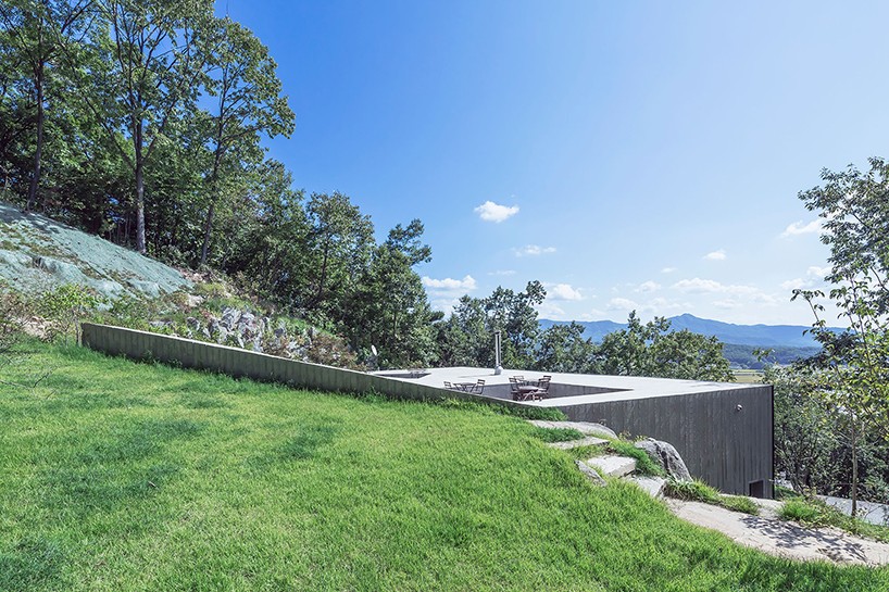 BCHO architects tilt roof house korea designboom