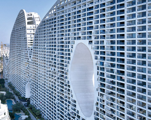 MAD architects reveals first images of its 'fake hills' community in beihai, china