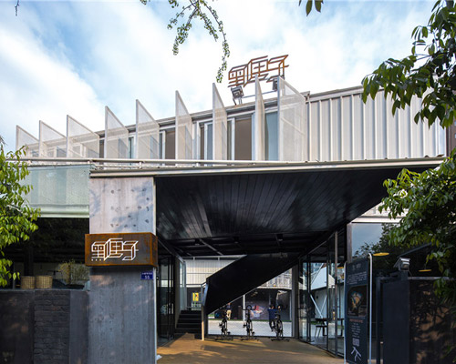 the black box gym by epos architects is defined by metal + glass
