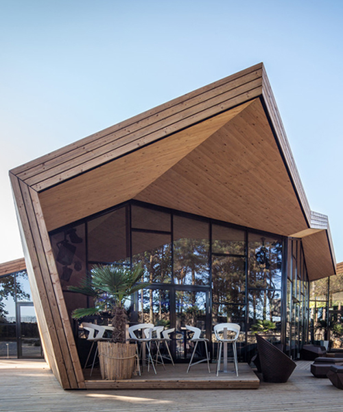 metaform architects construct origami structure for luxembourg beach club
