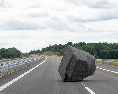 BORGMAN|LENK balance a papier-mâché boulder on a danish motorway