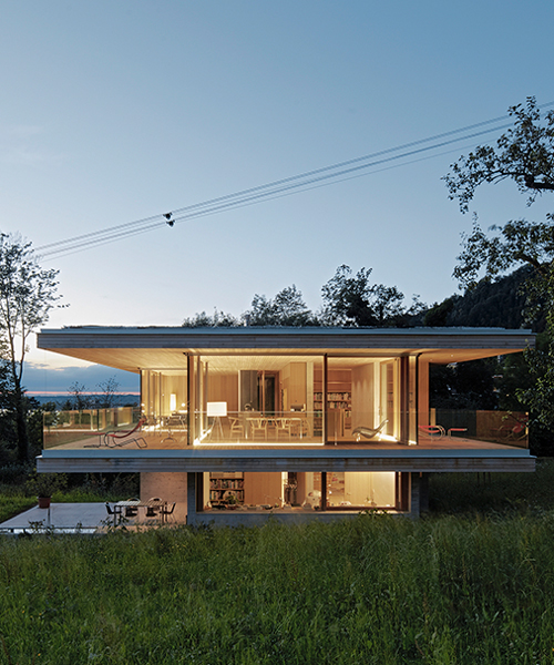 dietrich|untertrifaller wraps haus D in austria with oversized patio