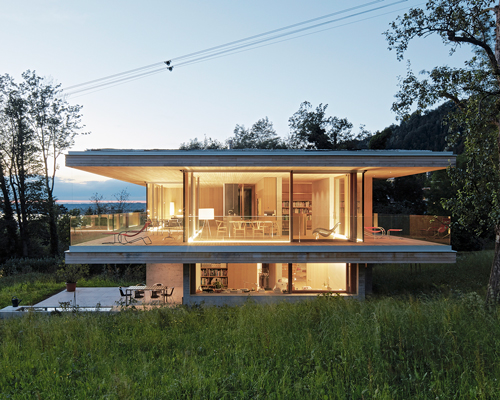 dietrich|untertrifaller wraps haus D in austria with oversized patio