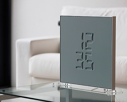 ETCH clock engraves time in a sculptural way