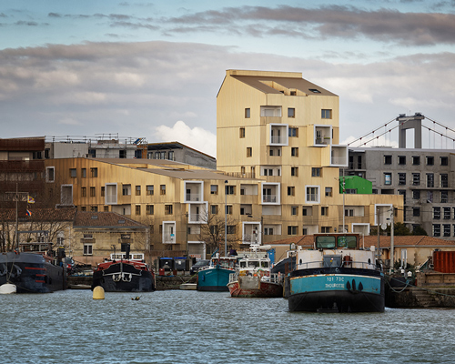hamonic + masson completes gold-colored 'urban dock' residences in bordeaux