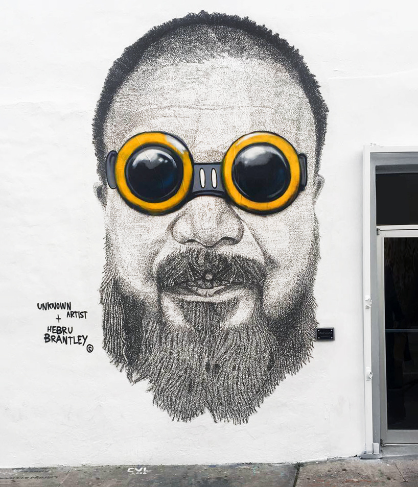hebru brantley puts goggles on ai weiwei in miami's wynwood district